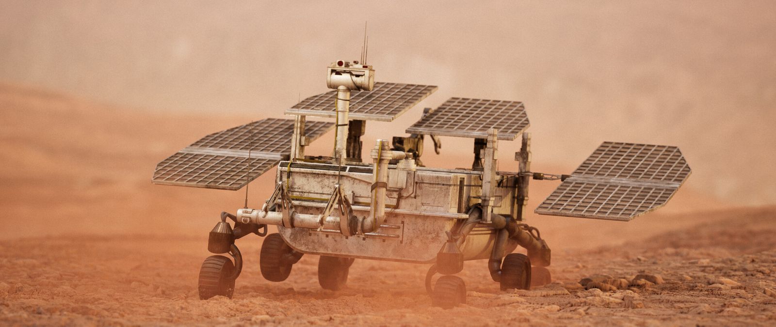 Rover crossing a dusty red desert